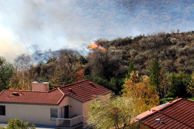Brush fire approaching southern california homes